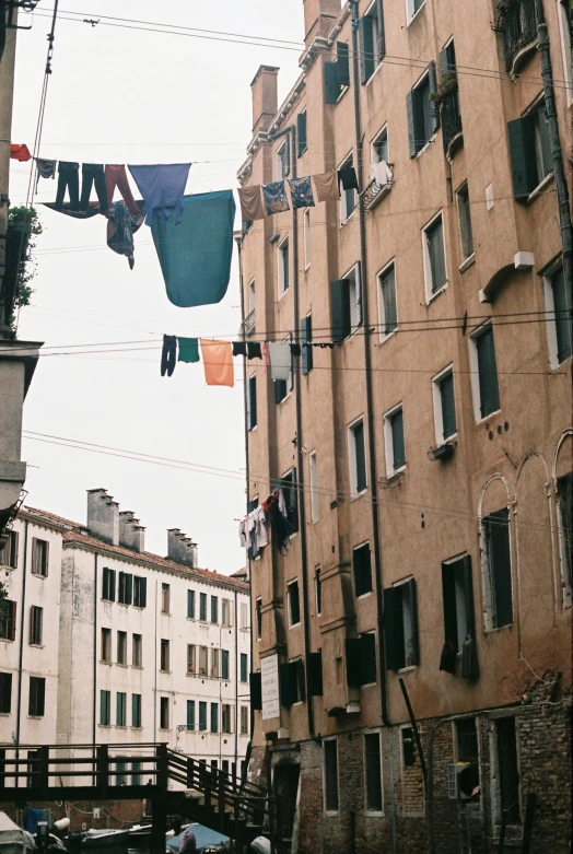 clothes hanging over an urban area with a bridge