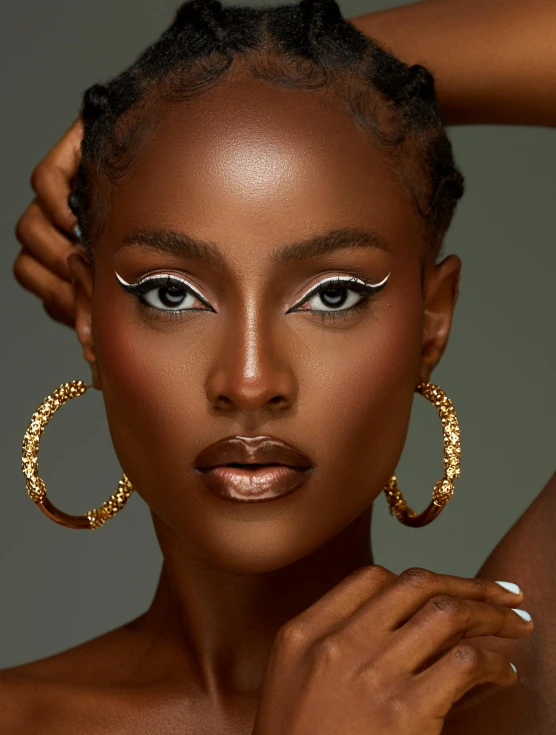 a woman with an afro hair and large earrings