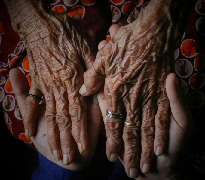 two people holding their hands open in front of them