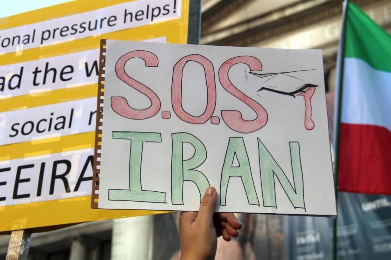 a sign reading sosfran with a poster holding it