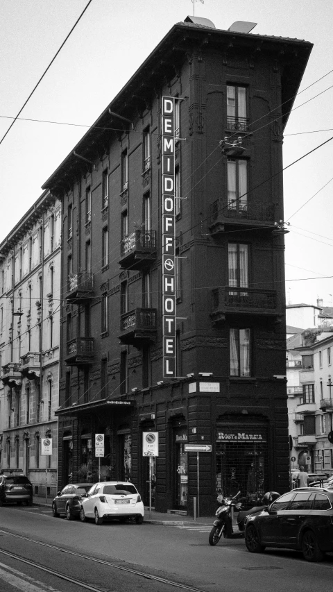 an old fashioned po of a building on a busy street