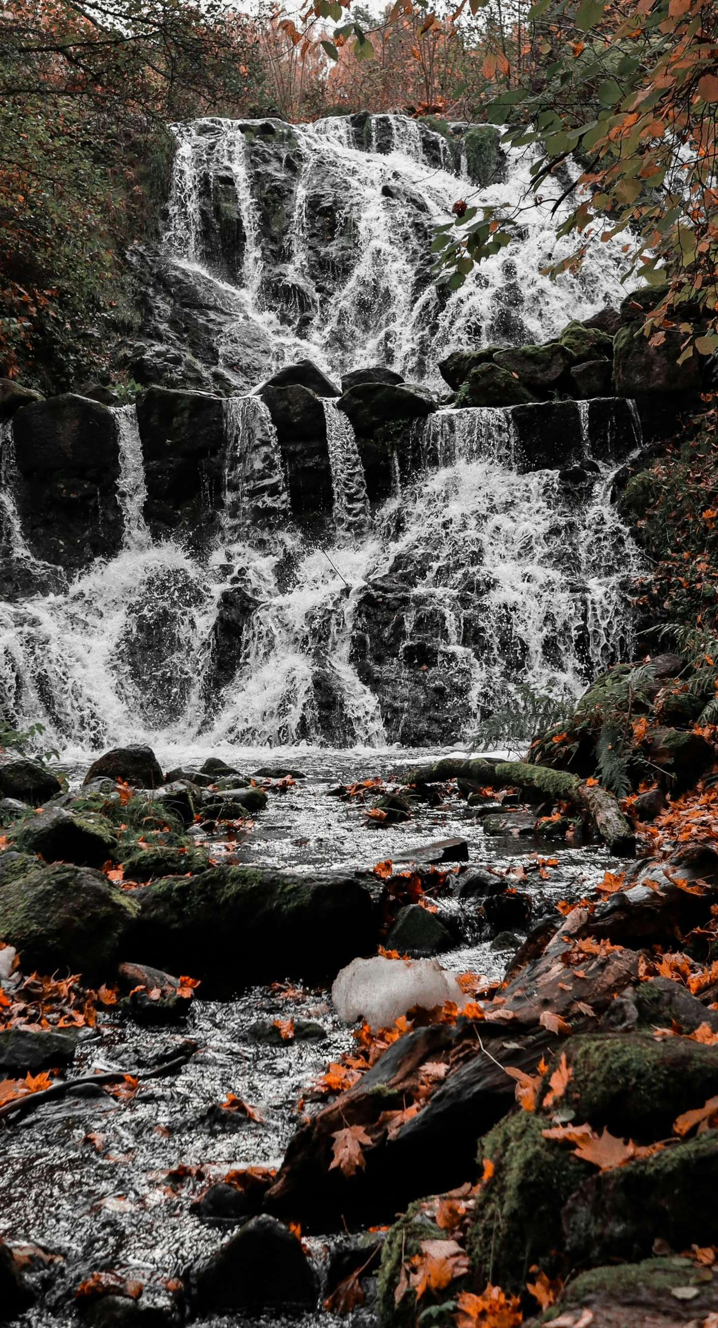 a river with many small waterfalls in the middle of it