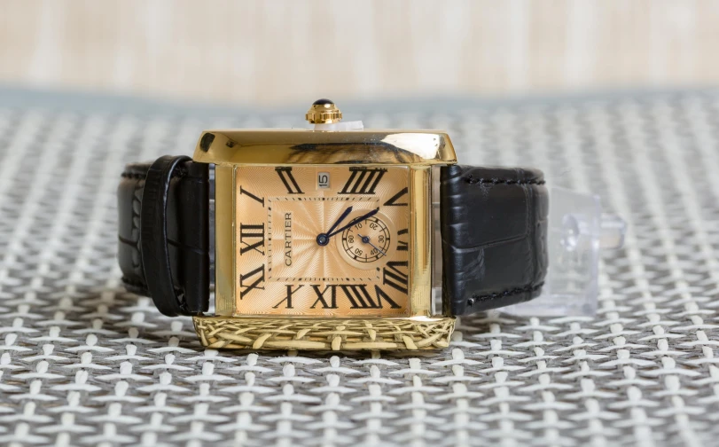 an image of a gold watch on display for purchase