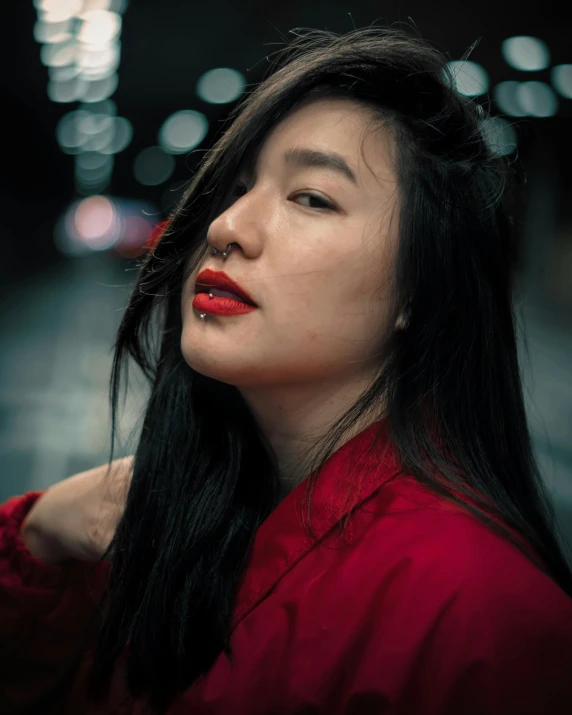 a woman with long hair is looking off into the distance