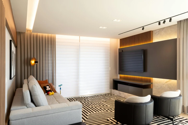 a living room with a modern feel and black - and - white pattern