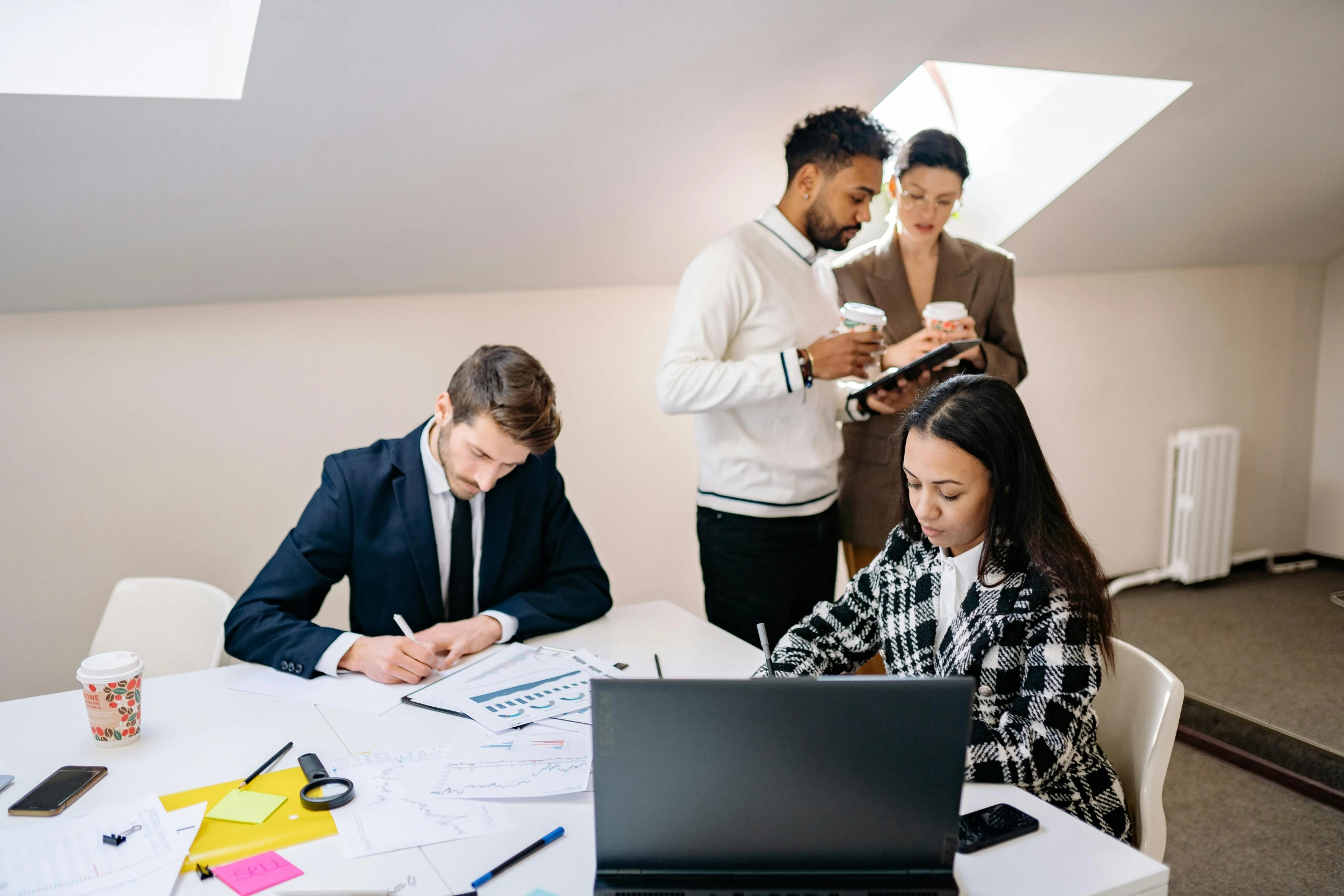 two business people are working on their computers