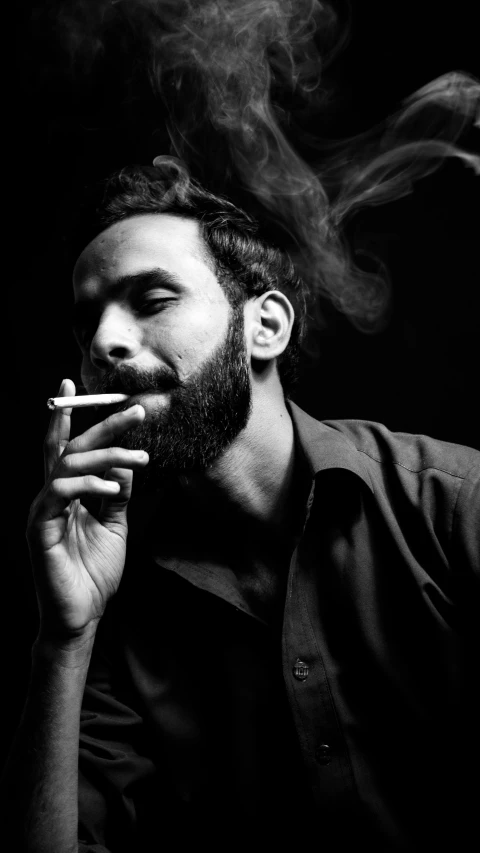 a man smoking an electronic cigarette