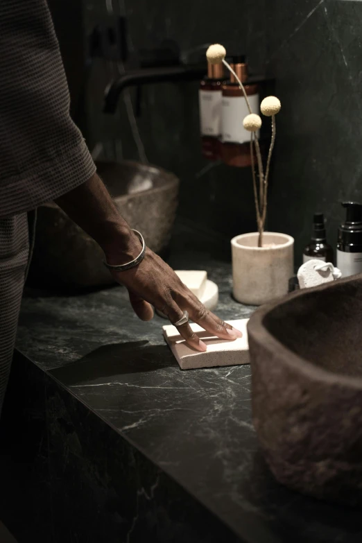 a person using a hand plane to cut soing