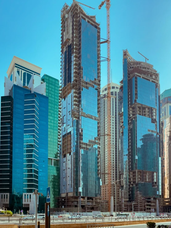 multiple architectural buildings are shown in front of a clear blue sky