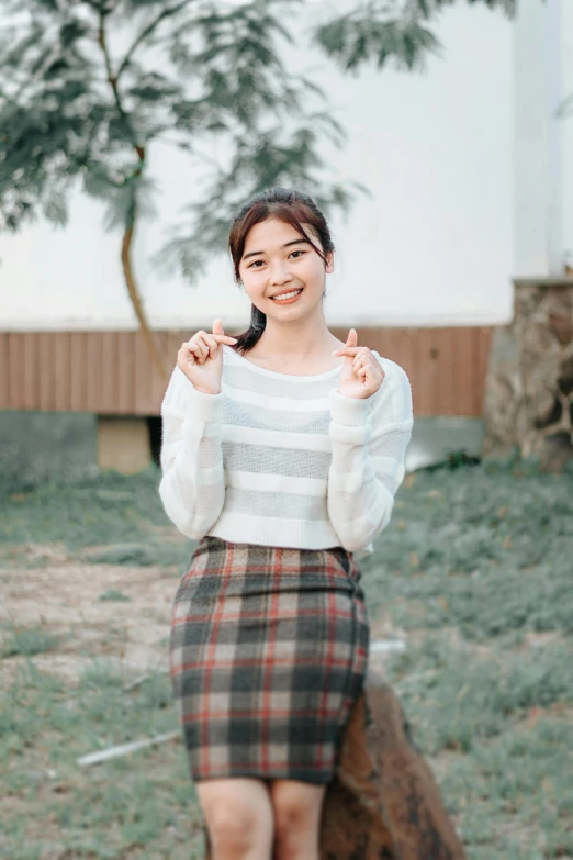 a girl is smiling while holding onto an umbrella