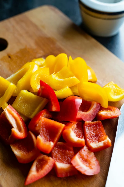 pieces of cut up food sitting on a  board