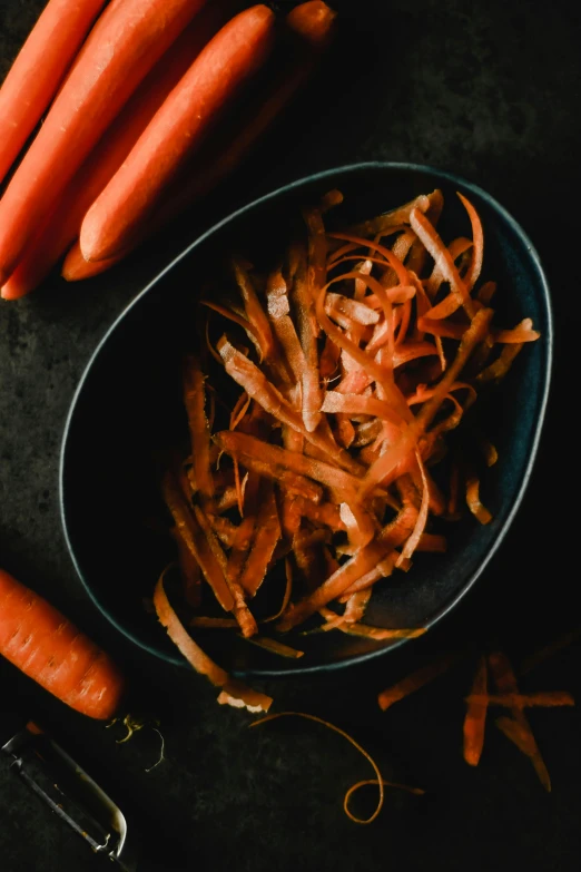 carrots and shredded carrot sticks in a bowl