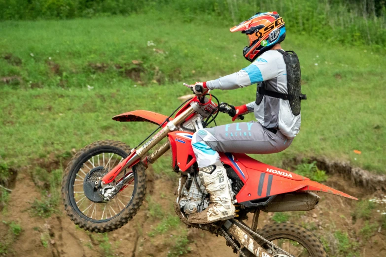 a person that is riding on a dirt bike