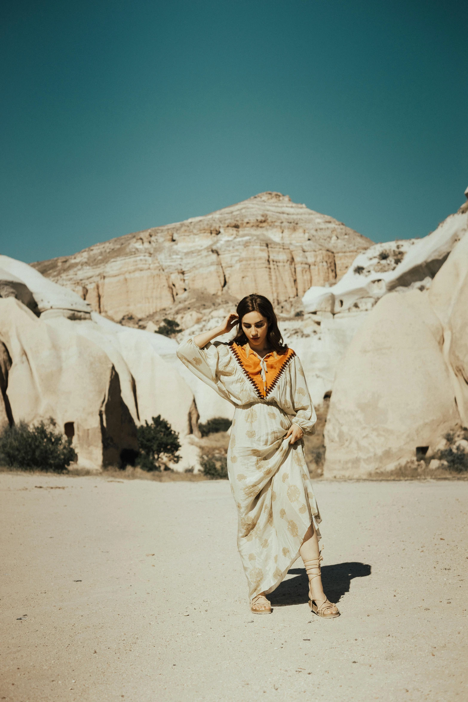 there is a woman wearing an indian outfit in the desert