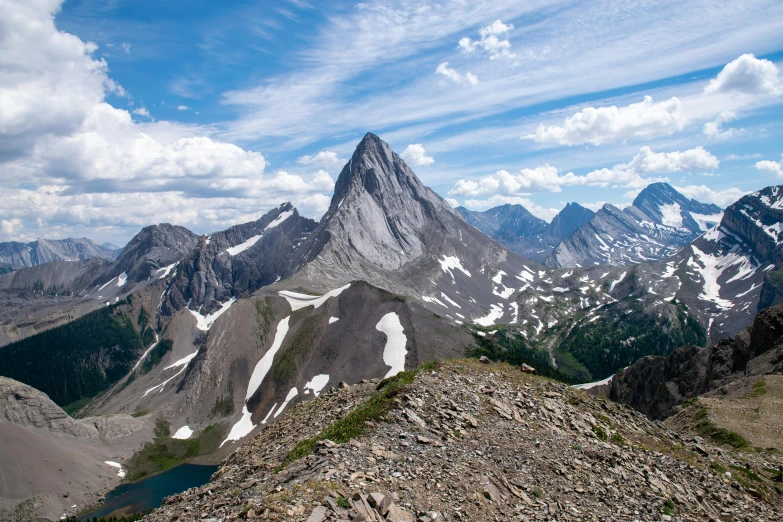 some mountains that are covered in snow and blue sky