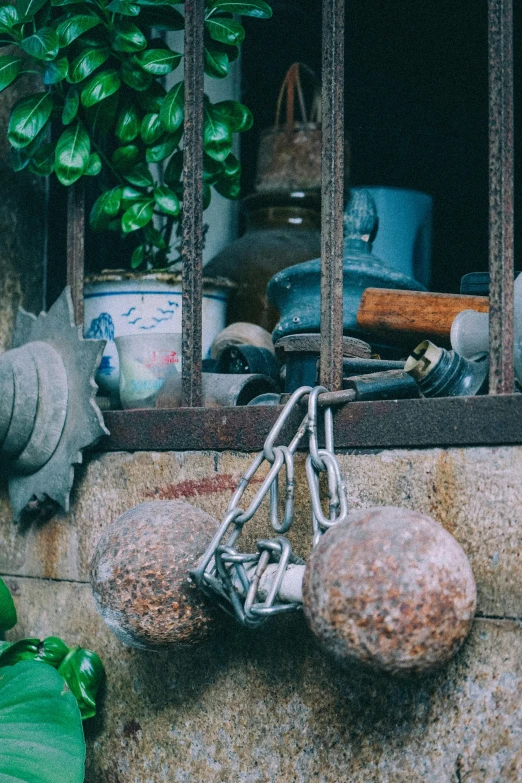 a concrete counter with three stone balls tied to the front