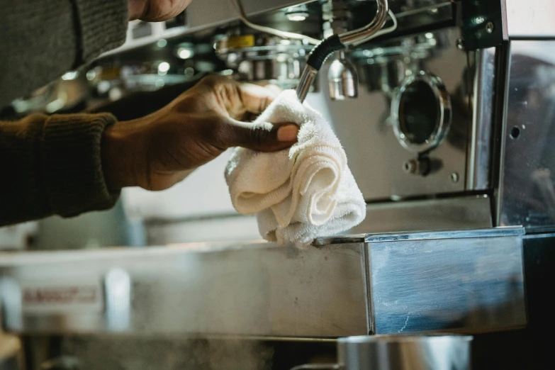 a person that is washing up some white towels