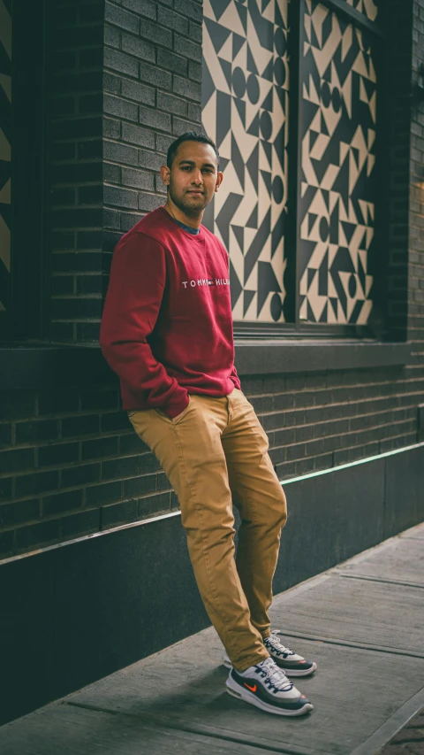 a man posing on the side of the street