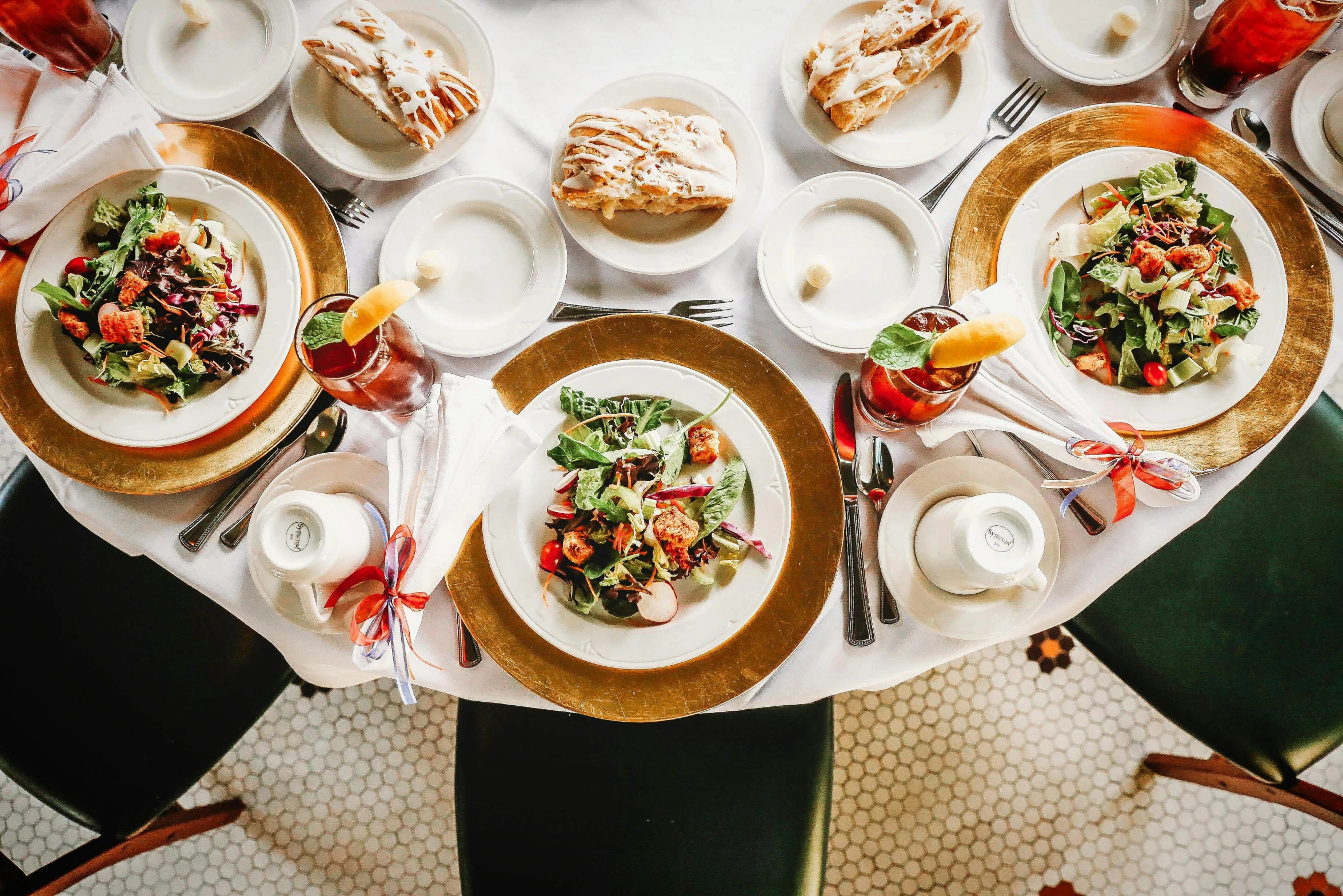 a table set with dishes, plates and utensils