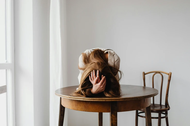 a person that is sitting in the middle of a table