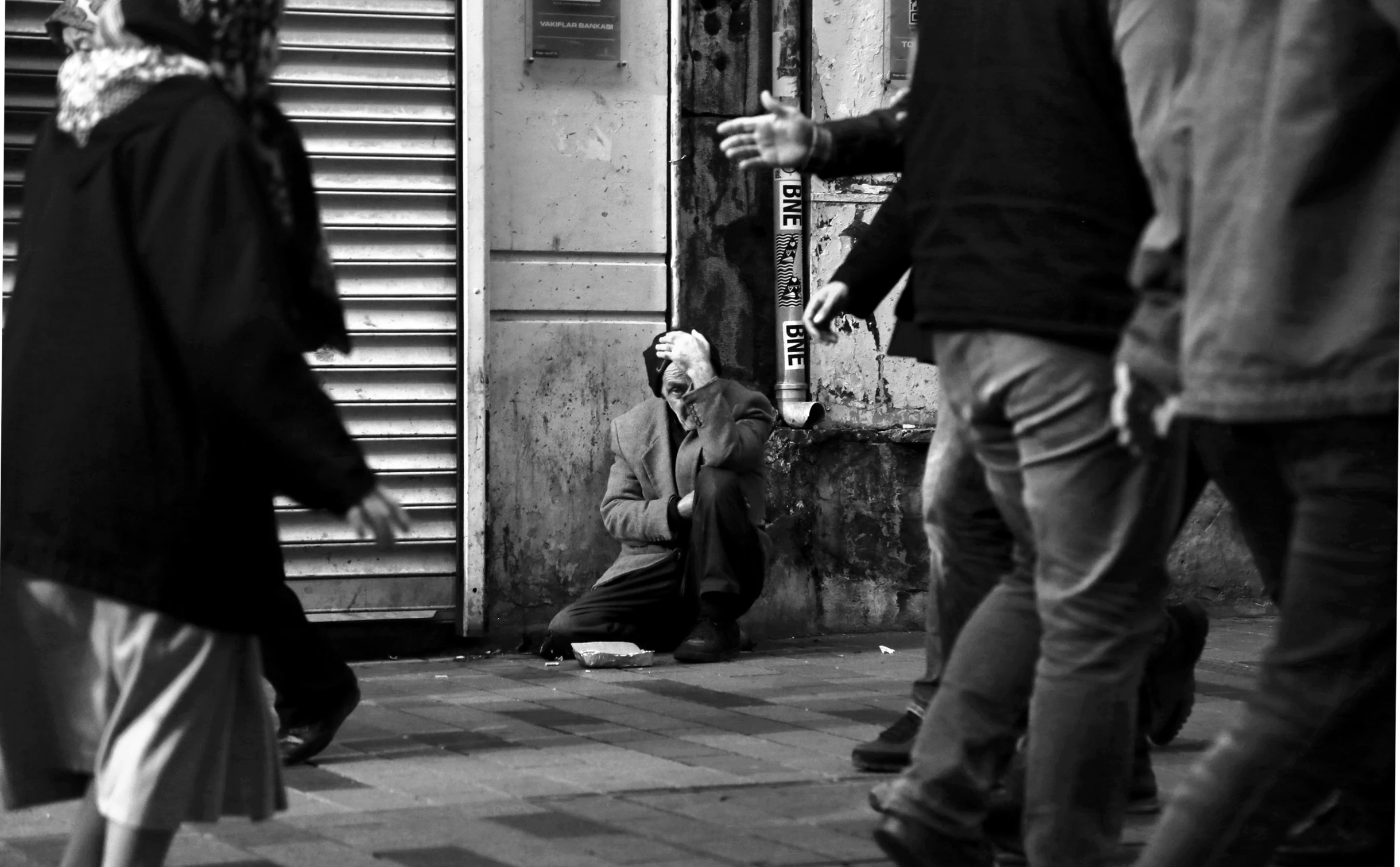 a black and white po of a person in the street