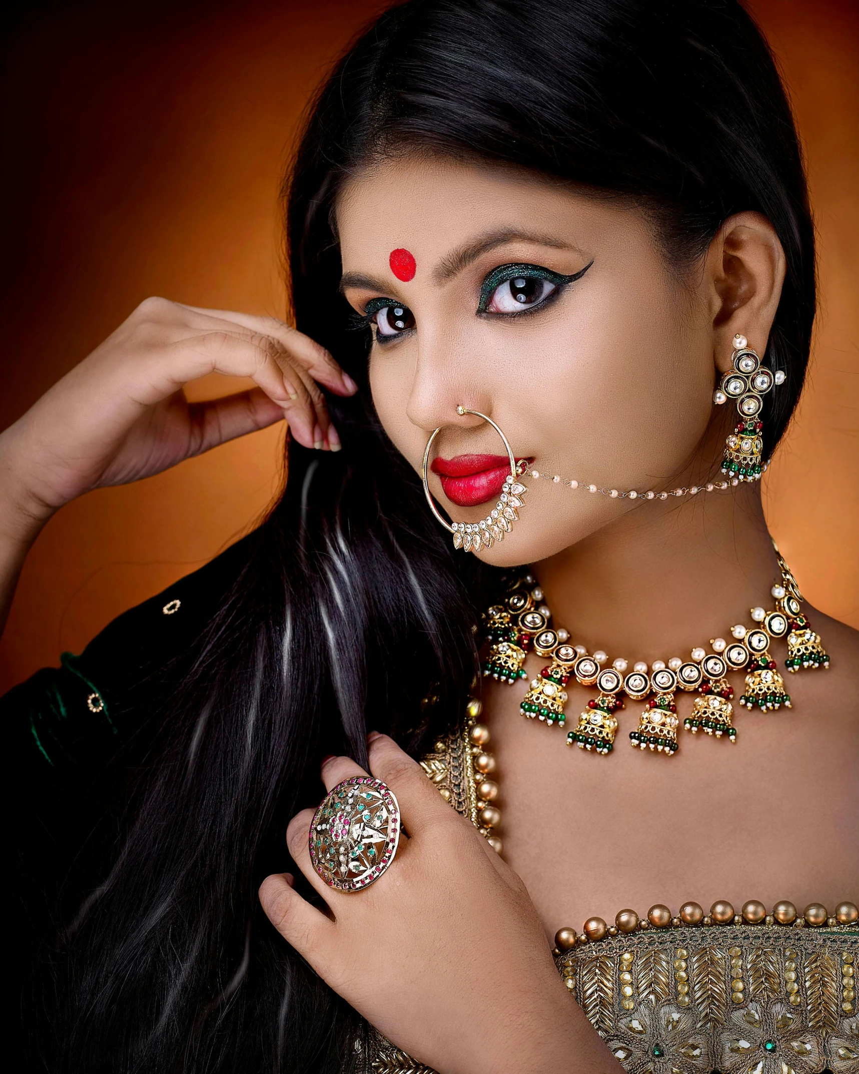 a woman in indian dress poses for the camera