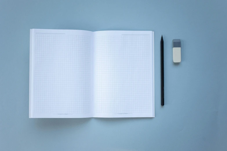 notebook and pencil laying open with numbers on paper