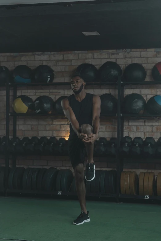 a man does some exercises in a gym