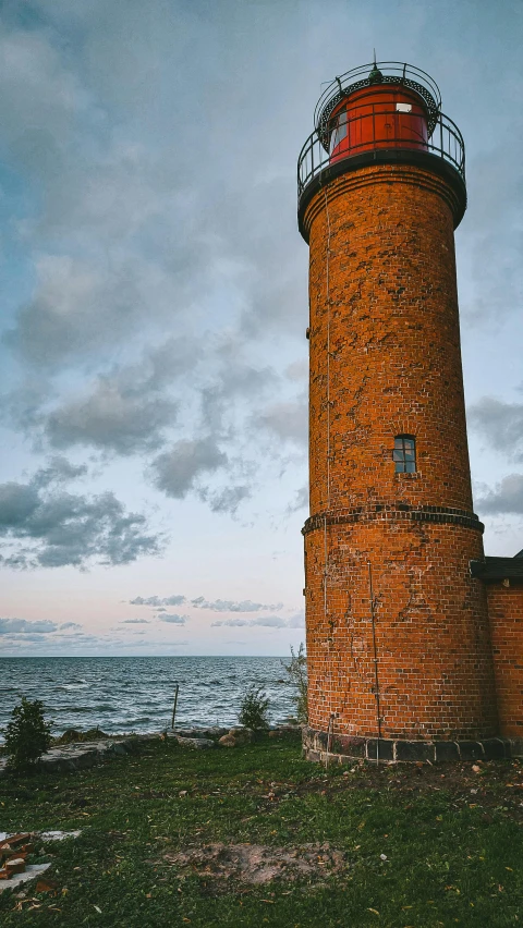 there is a very tall light house in the ocean