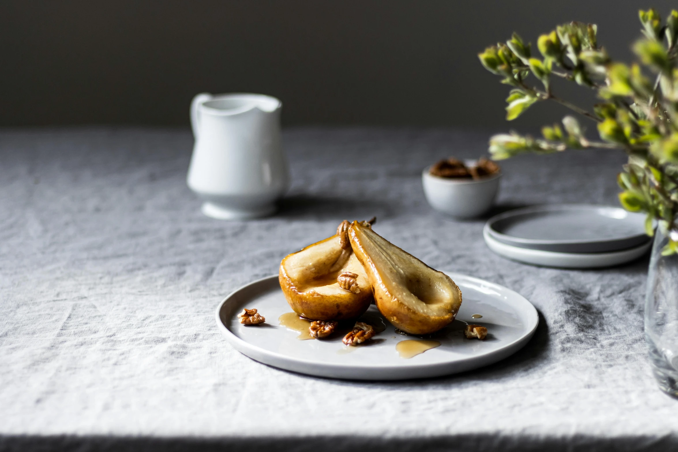 some nuts are sitting on top of a white plate