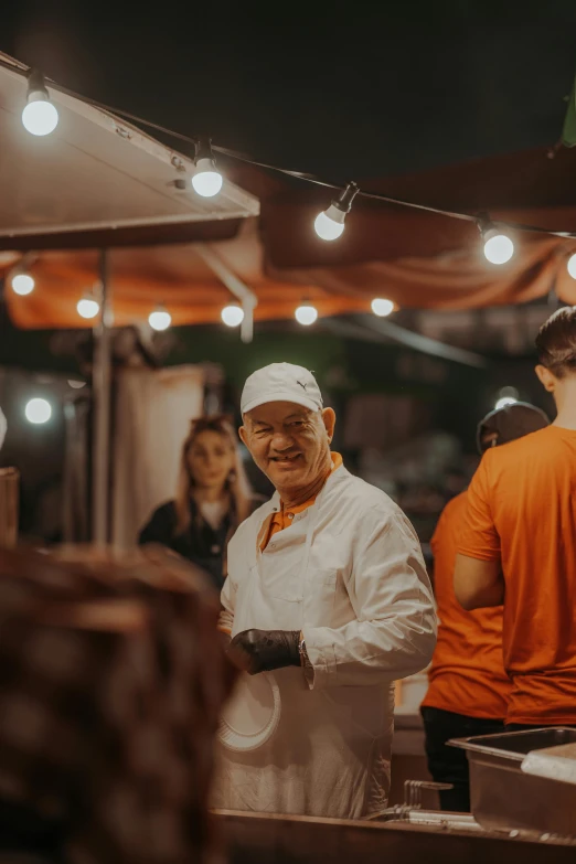 a chef is preparing food in the open market