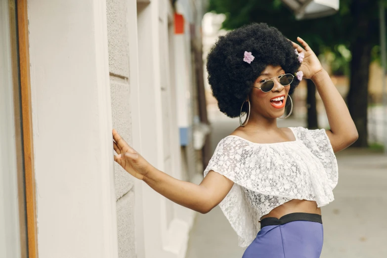 an african woman with short hair and a big afro