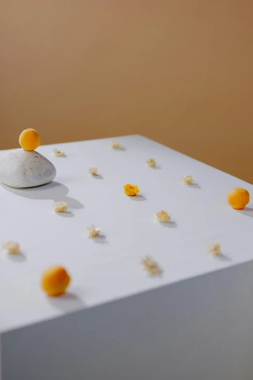 orange and white decorations on a table by itself