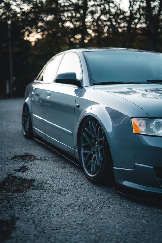 a audi car sitting in the middle of the road