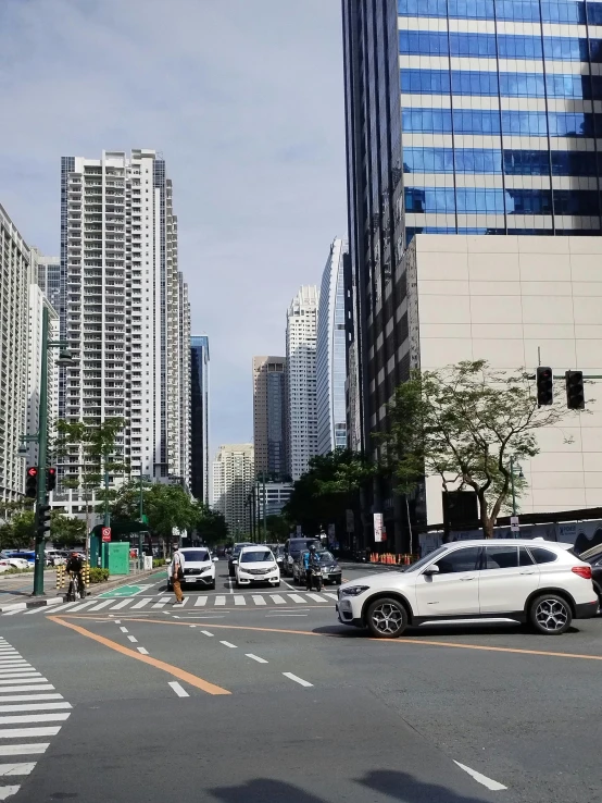 the city has cars stopped on the busy road