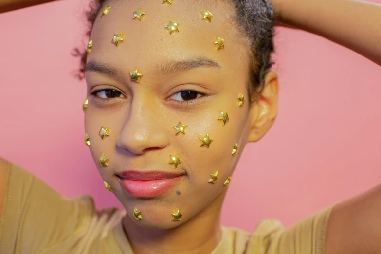 a little girl with stars painted on her face