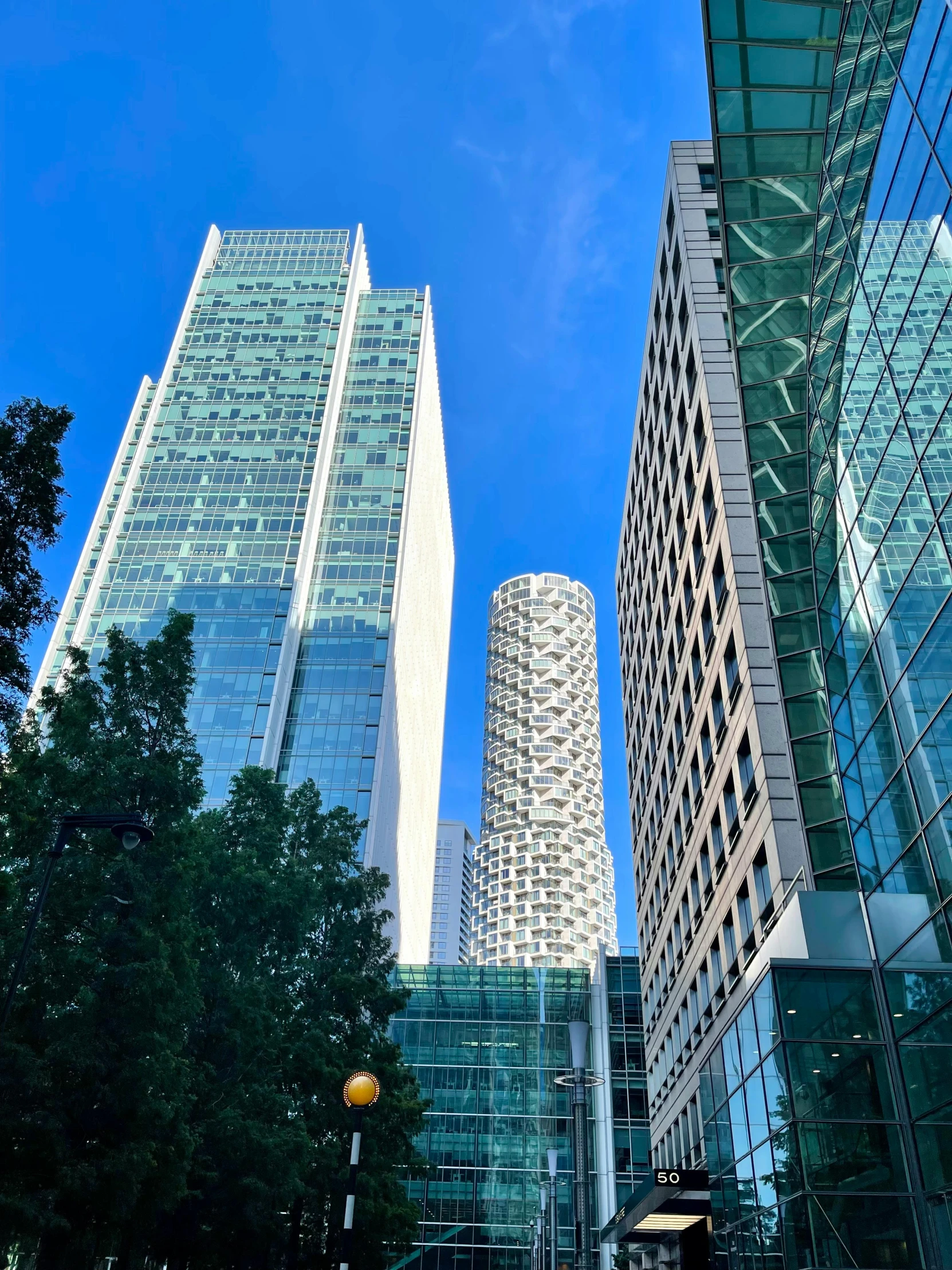 a street with several tall buildings that stand in the distance