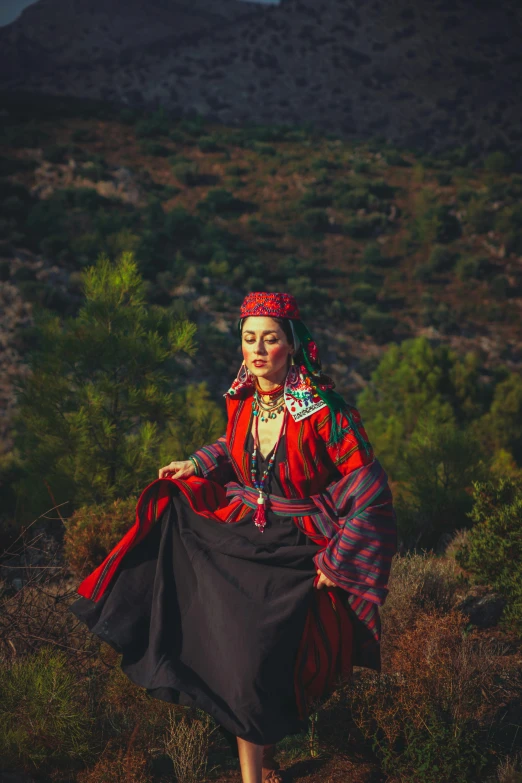 a woman in a dress posing for the camera