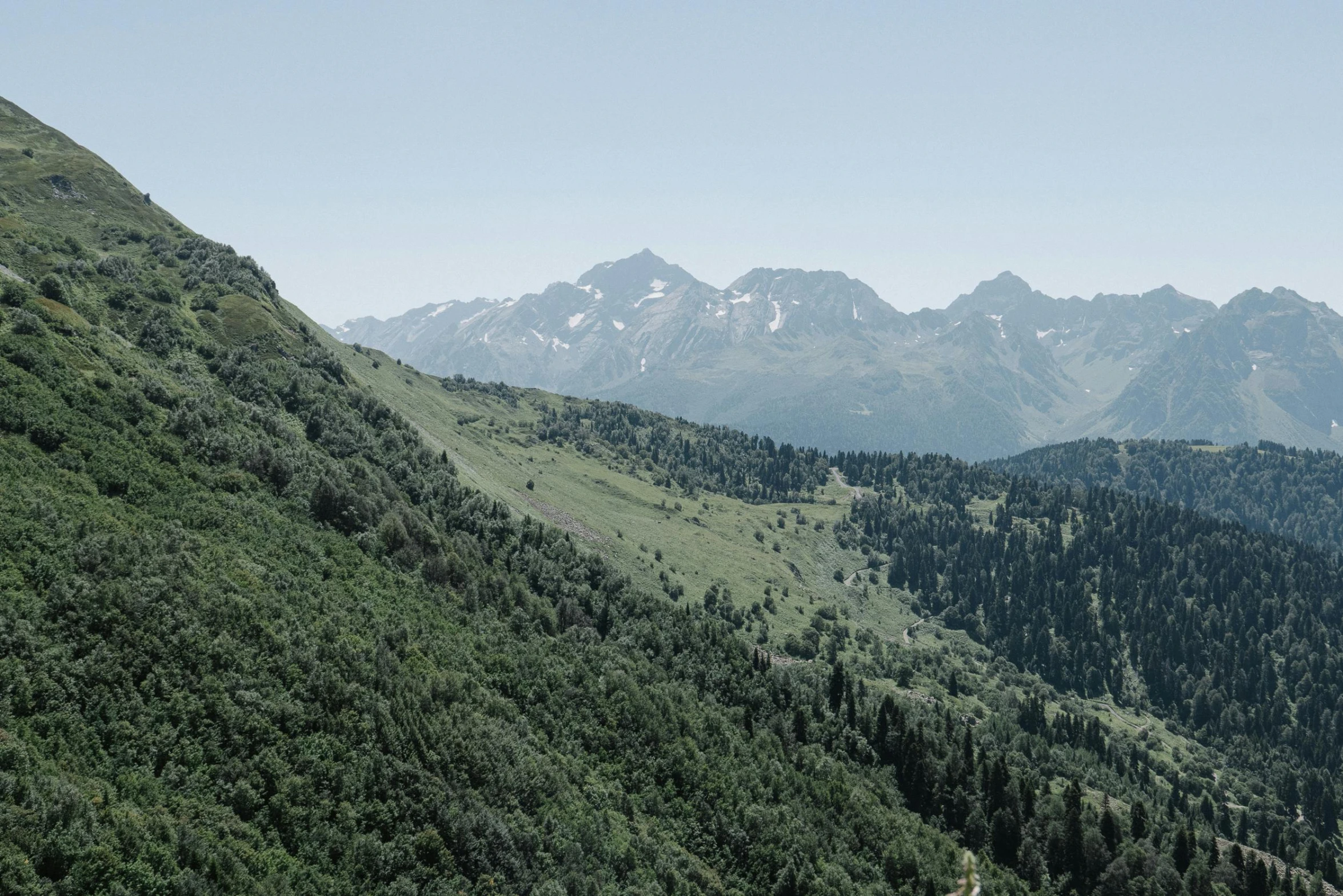 an overview of green mountains and a valley