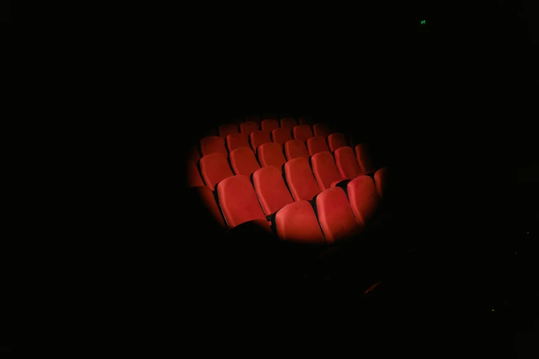 a lit up stage in the middle of an auditorium