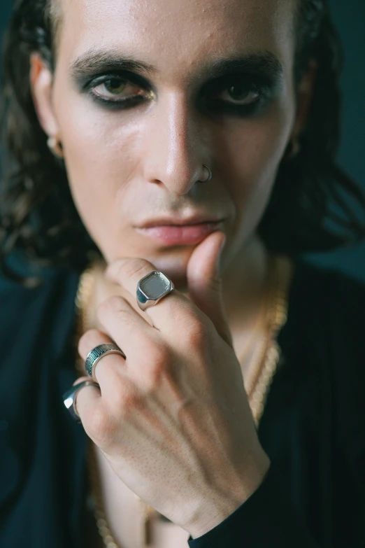 a close up of a person with a ring on her hand