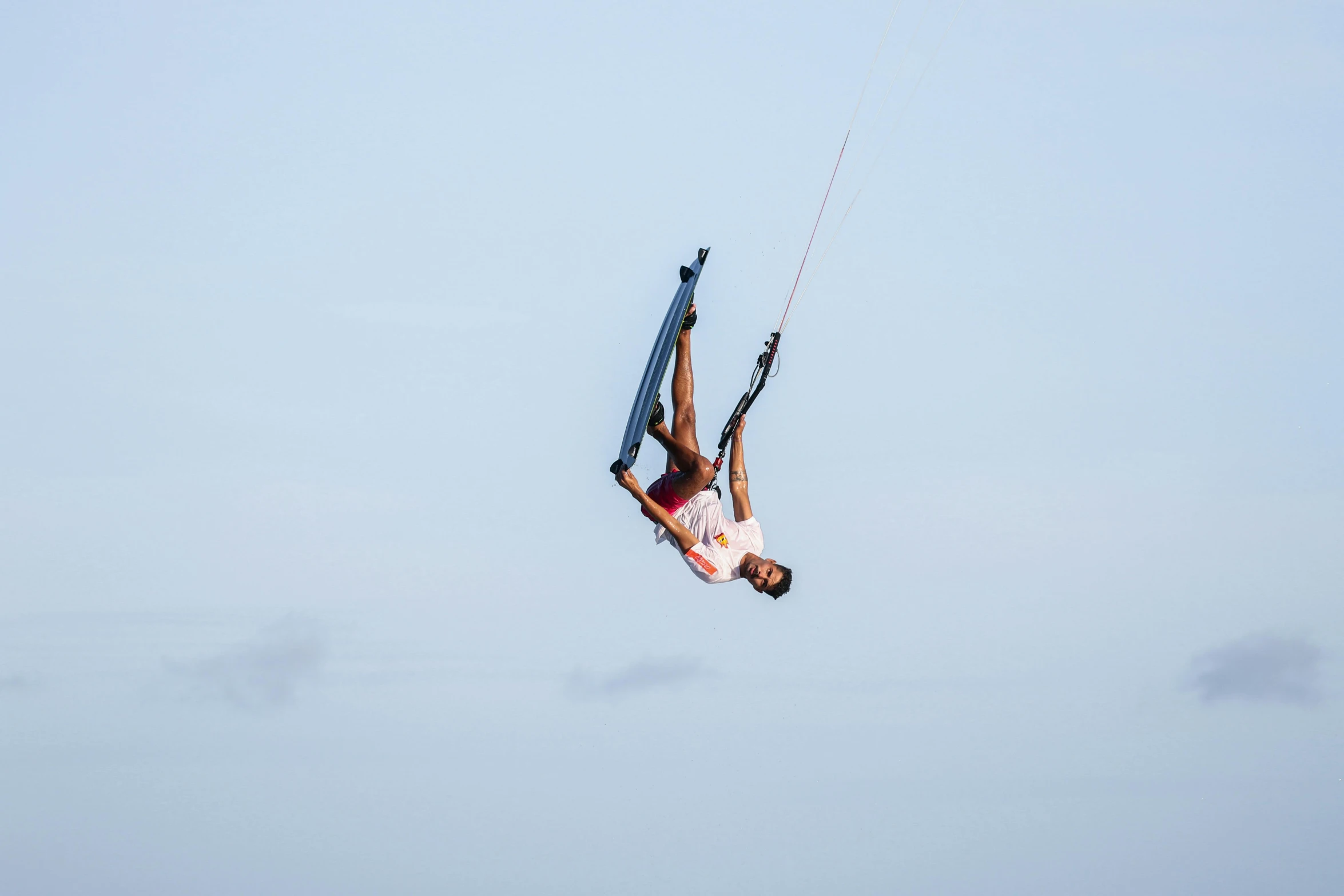 a guy is doing tricks on his wake board