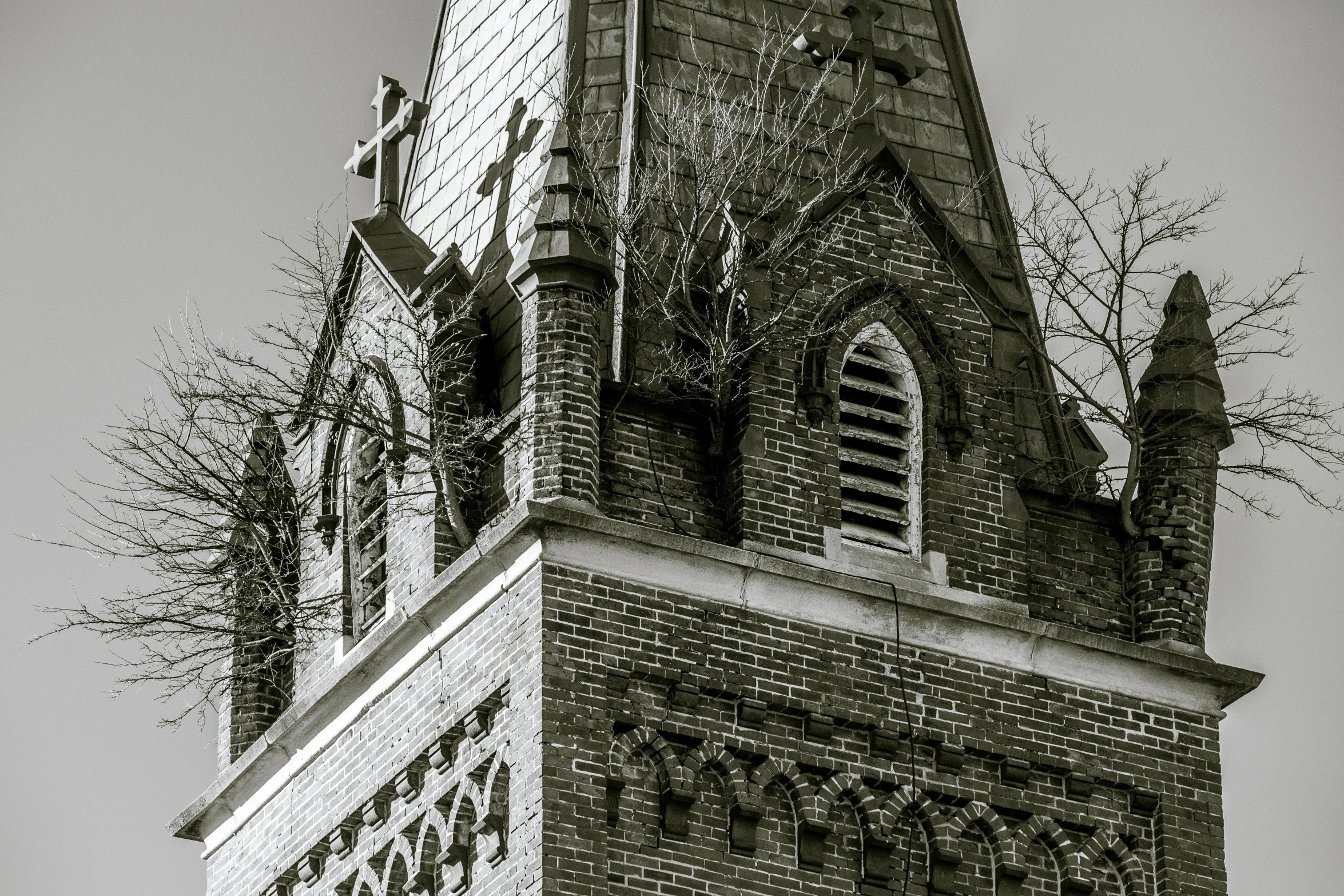 a black and white po of a church tower with steeples