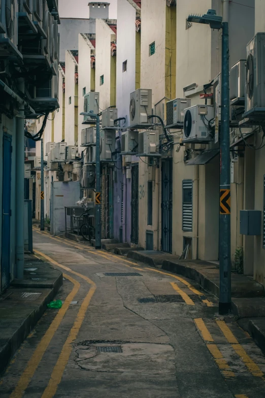 there is a empty street near a building