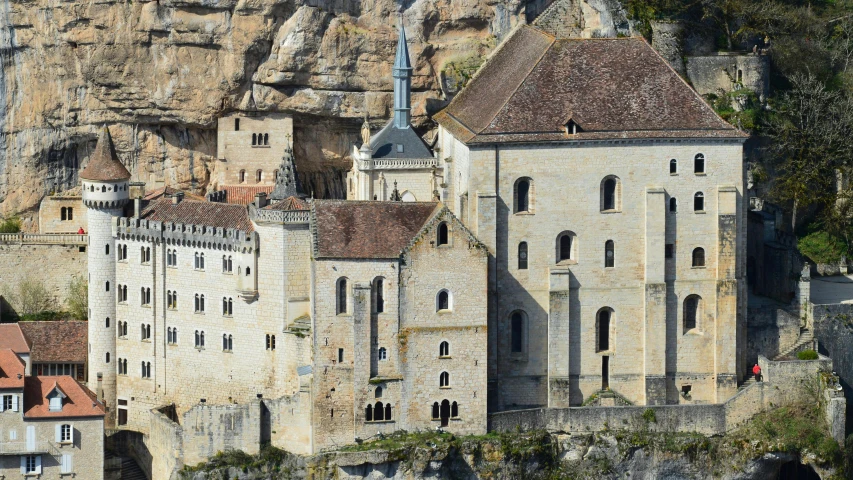 there are many buildings that stand on the cliff side