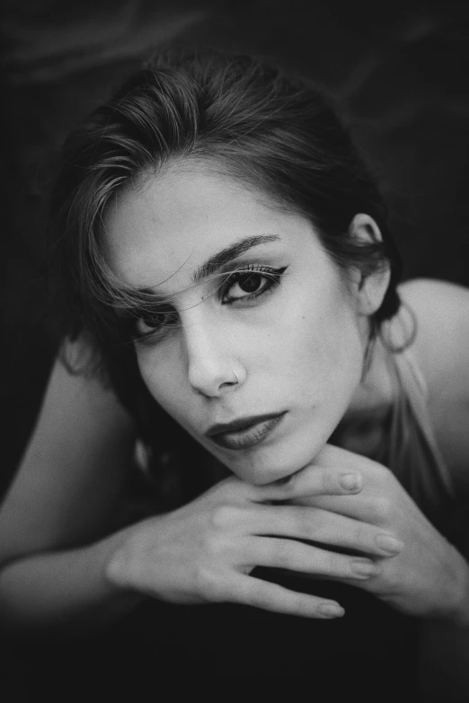 the beautiful woman is posing in black and white