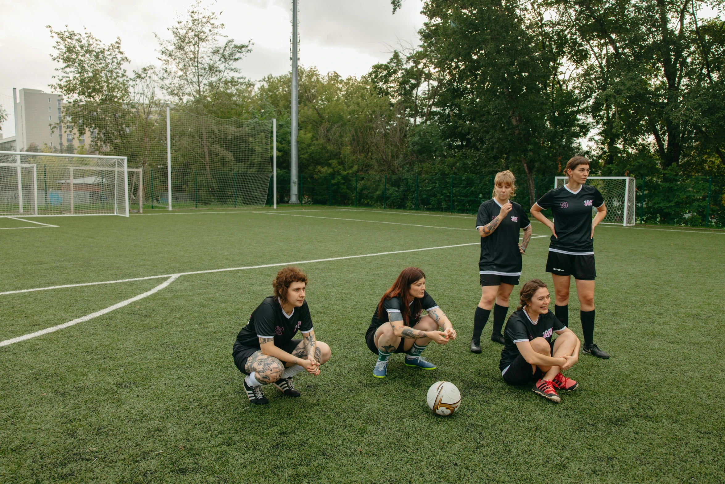 a group of children playing soccer on a field