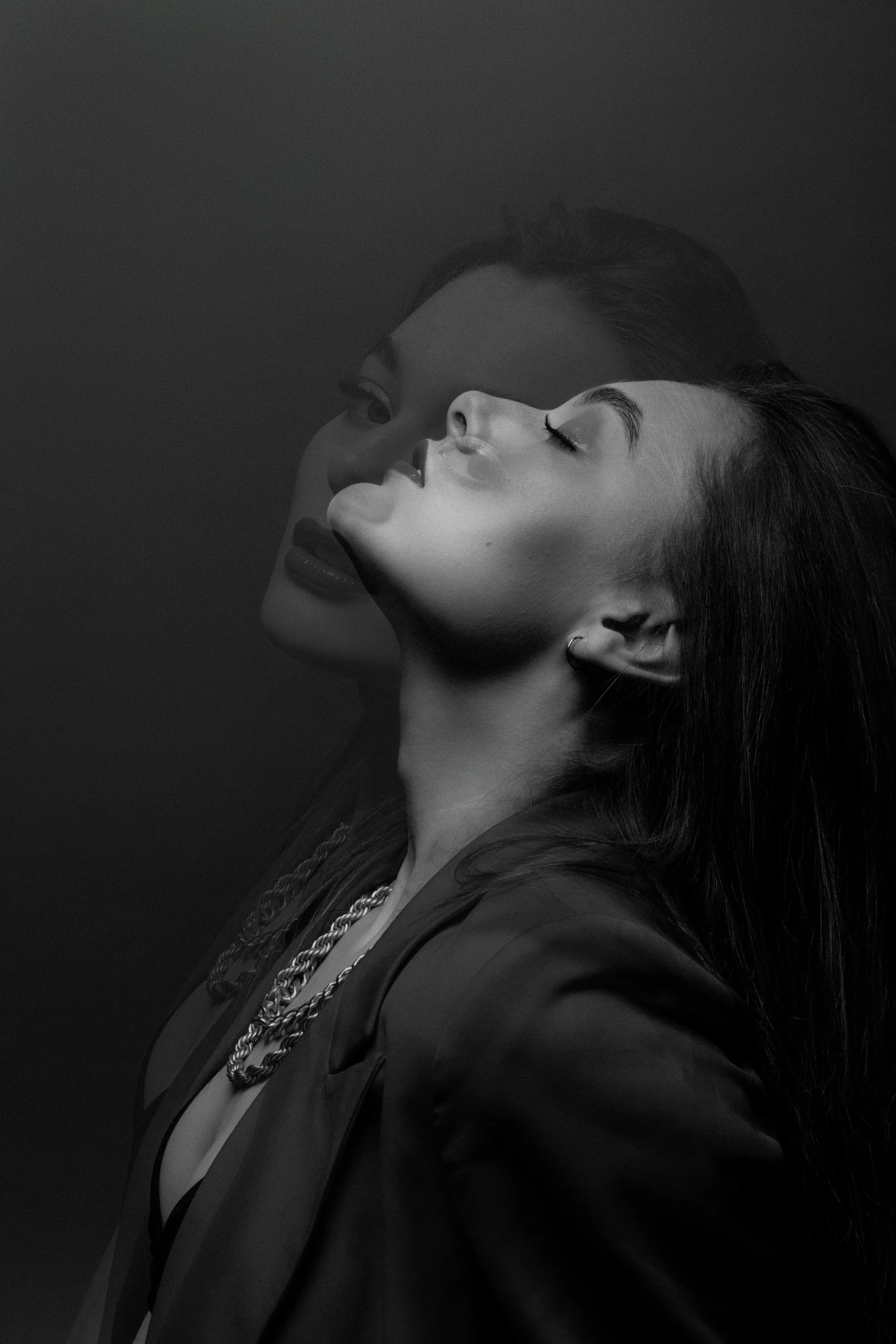 black and white image of woman facing away from camera