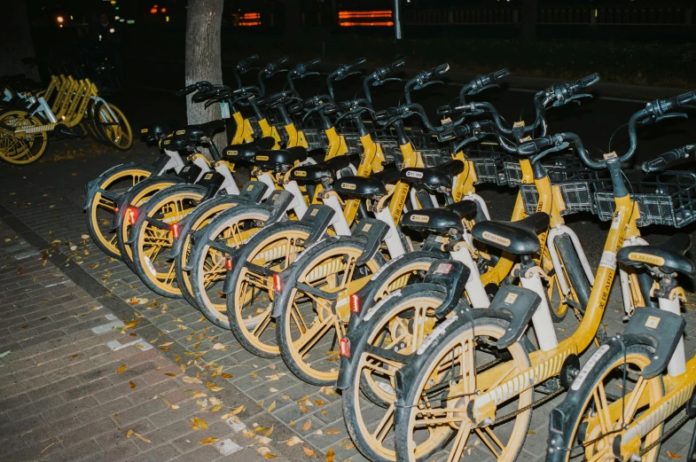 a row of bikes are shown with yellow and black tires