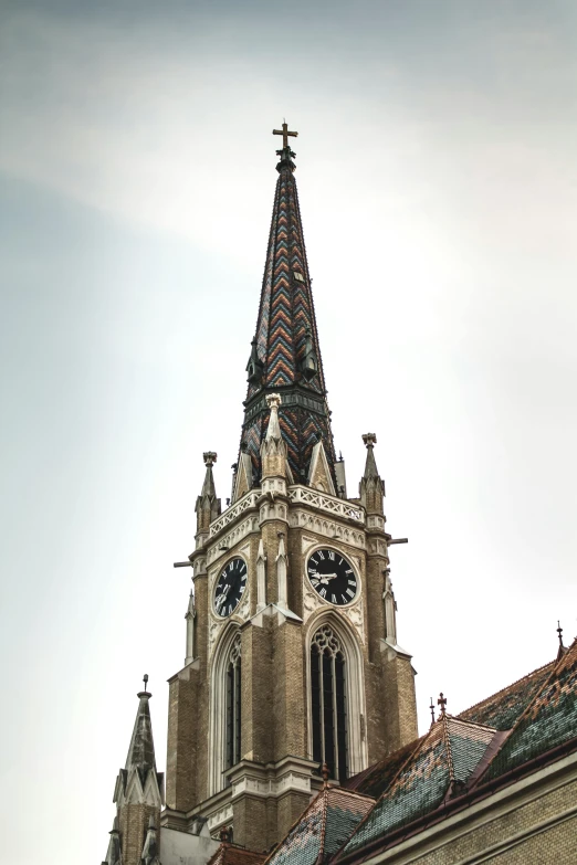 a building with a clock on the tower and a steeple